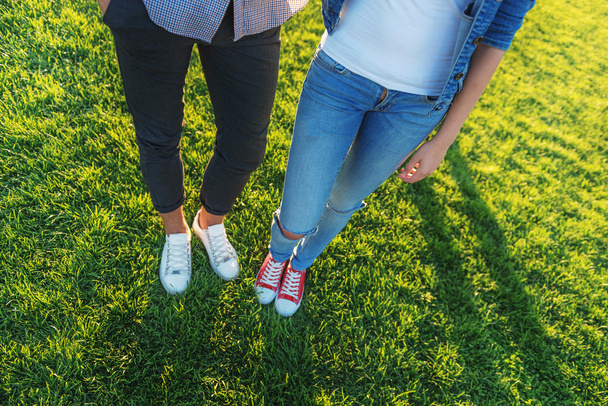two friends standing in sneakers outdoors - Photo, image