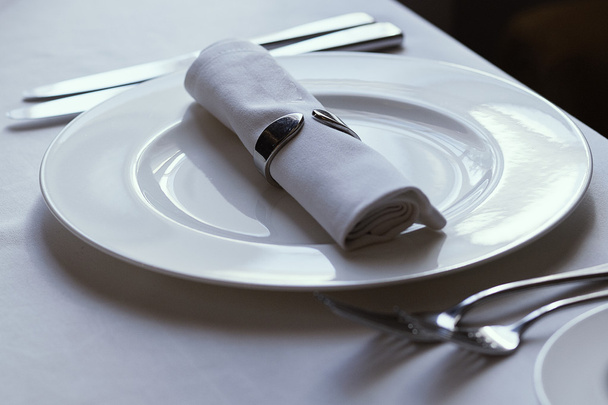 Knife, fork and spoon with linen serviette, isolated on the white background, clipping path included. - 写真・画像