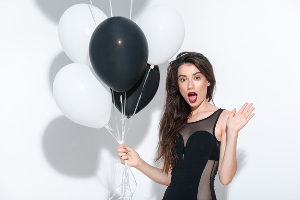 waist up of a beautiful seductive model holding balloons - Foto, Imagem