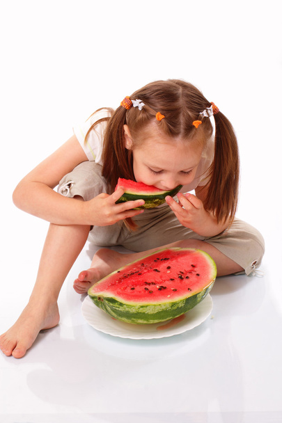 Pretty child eating watermelon - Foto, Bild