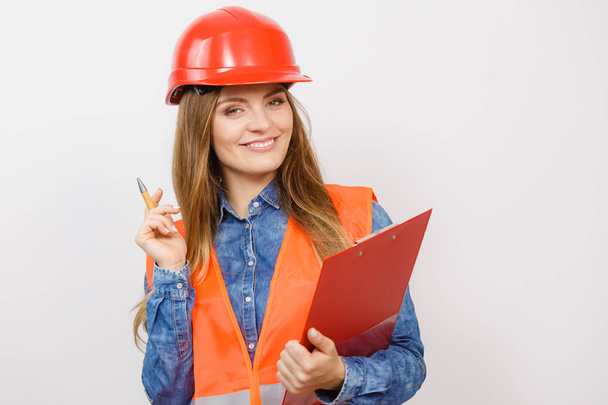 Woman engineer construction builder in helmet. - Foto, afbeelding