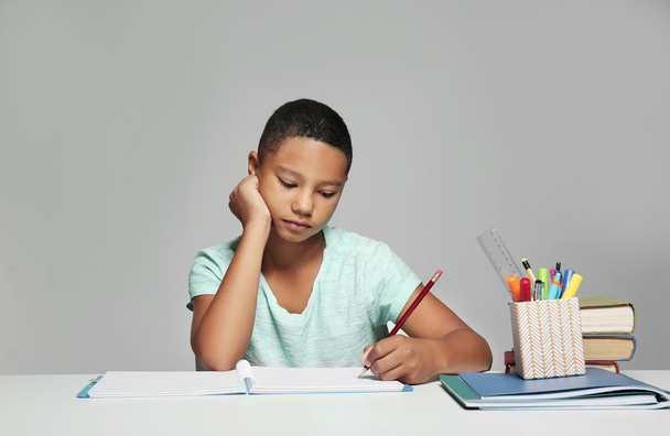 African American boy making homework  - Valokuva, kuva