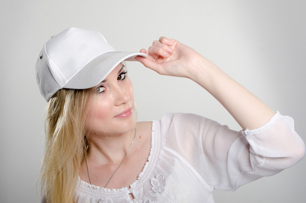 the girl in the white cap - Фото, изображение