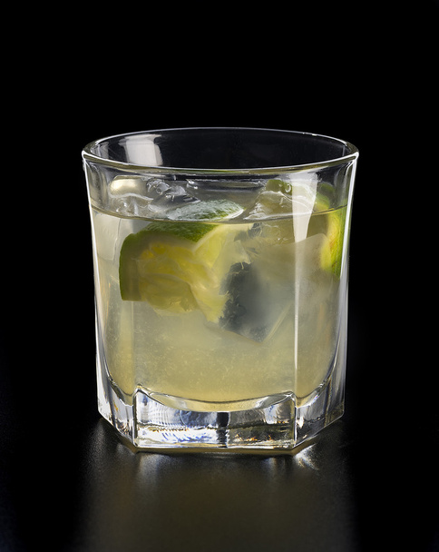 homemade fresh lemonade with lime and ice cubes in glass - Photo, image