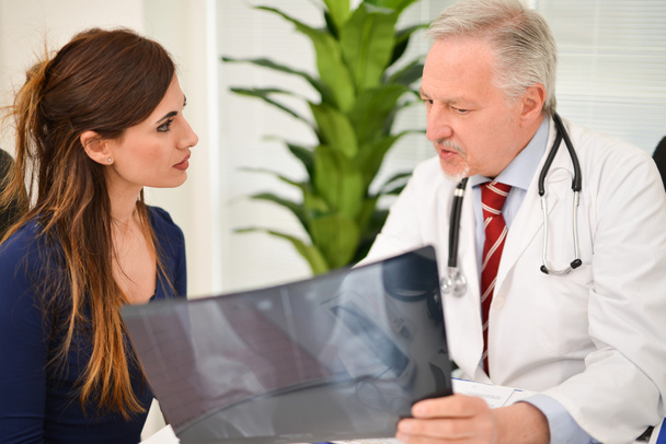 Doctor speaking to his patient - Photo, Image