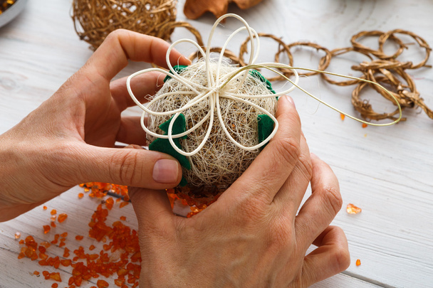Creative diy hobby. Handmade craft christmas decoration, balls and garland - Photo, Image