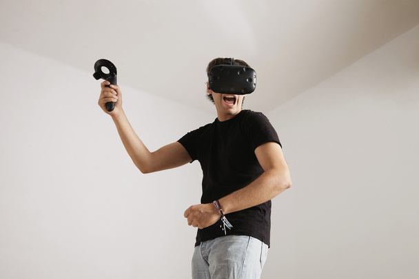 young gamer in VR glasses - Фото, изображение