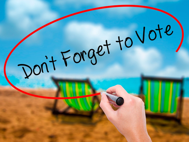 Man Hand writing Don't Forget to Vote with black marker on visua - Photo, Image