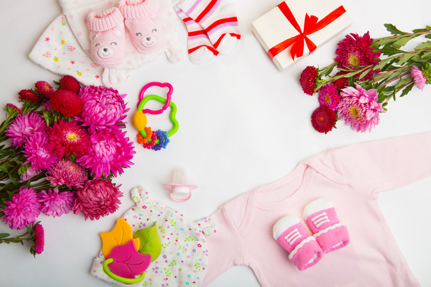 top view set of fashion trendy pink stuff for baby girl, baby fashion concept. newborn baby clothes - Foto, Bild