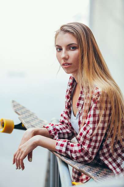 young beautiful woman with longboard - Fotografie, Obrázek