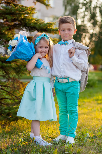 Funny beautiful couple. beauty little girl and boy together.  - 写真・画像