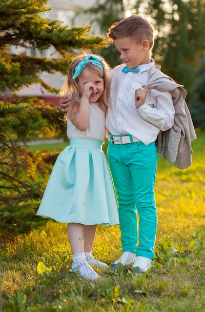 Funny beautiful couple. beauty little girl and boy together.  - Fotó, kép
