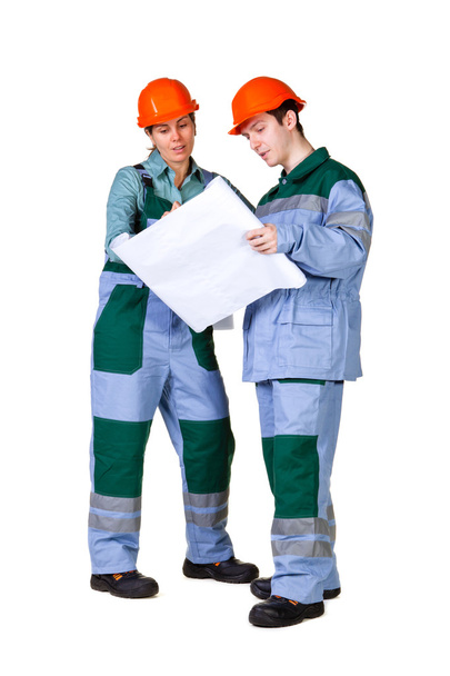 Isolated picture of young construction workers with blueprint - Foto, Bild