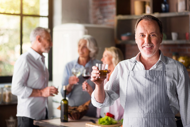 White middle-aged cook saying a toast looking at camera - Photo, Image