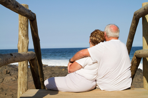 Rear view of senior couple on beach - Foto, Bild