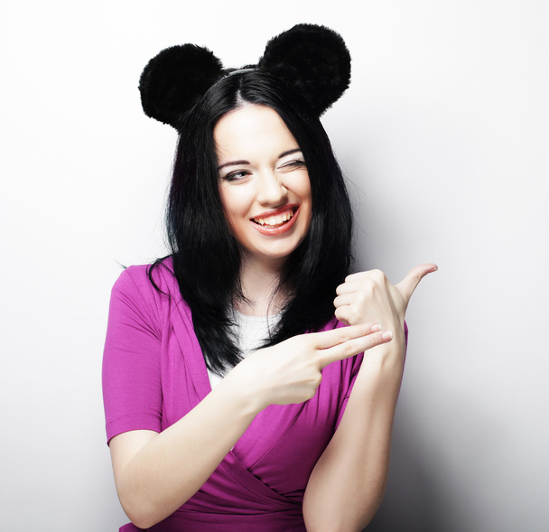 Surprised funny young woman with mouse ears - Photo, image
