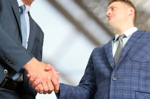 The Close-up image of a firm handshake between two colleagues in  office. - Photo, Image