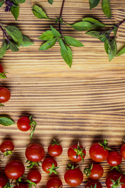 tomatoes cherry and Basil on wooden background. - Zdjęcie, obraz