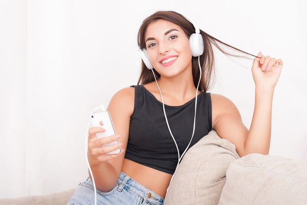 Young beautiful woman in headphones - Foto, Imagen