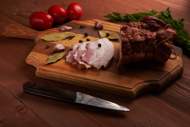 bacon and seasonings on a wooden table - Φωτογραφία, εικόνα