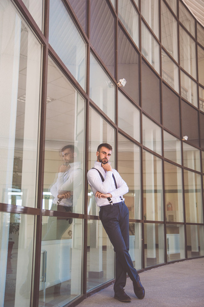Sexy businessman with beard is wearing suspenders - Fotografie, Obrázek