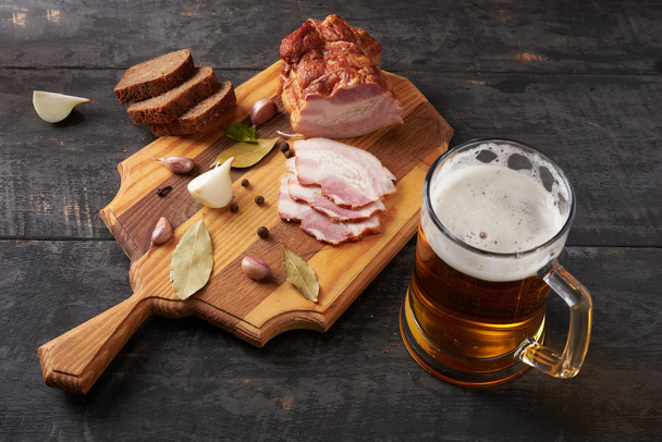 bacon and glass of beer on a table - Φωτογραφία, εικόνα