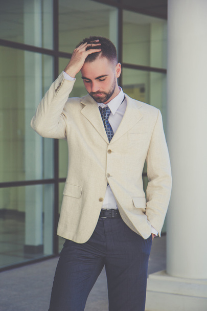 Businessman with beard having headache - Фото, зображення