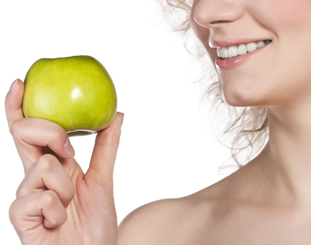 Healthy teeth and green apple. Studio shoot - Photo, Image