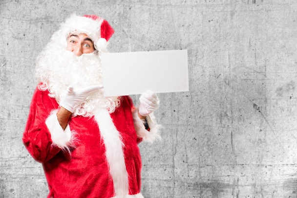 Санта-Клаус с плакатом - Фото, изображение