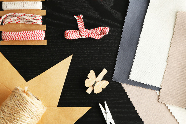 Sewing creative accessories on black wooden background, top view - Φωτογραφία, εικόνα