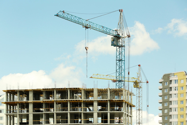 Crane and building construction on sky background - Photo, image