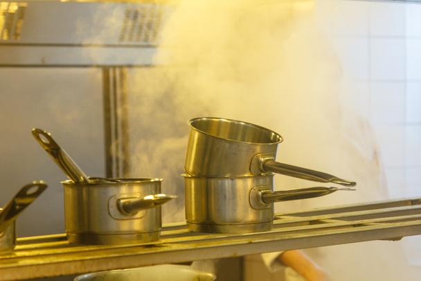Work in the kitchen: steam, heat, pan, cook - 写真・画像