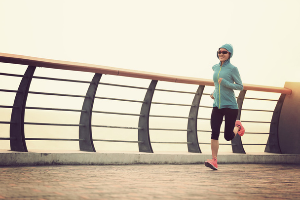 woman running at seaside - Фото, зображення