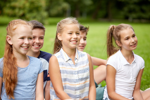 group of happy kids or friends outdoors - Photo, image