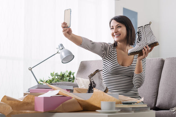 Woman taking a selfie with her new purchases - Фото, зображення