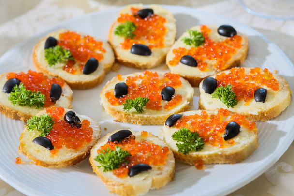 Sandwiches with butter and red caviar - Photo, Image