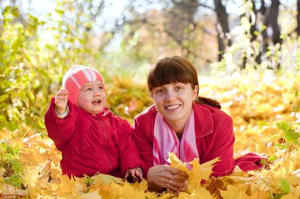 Mother and baby in autumn park - Photo, image