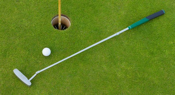Golf hole with ball and putt - Photo, Image
