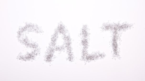The word salt spelled out on a grey background - Foto, immagini