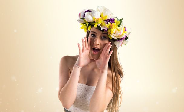 Girl with crown of flowers shouting - Фото, зображення