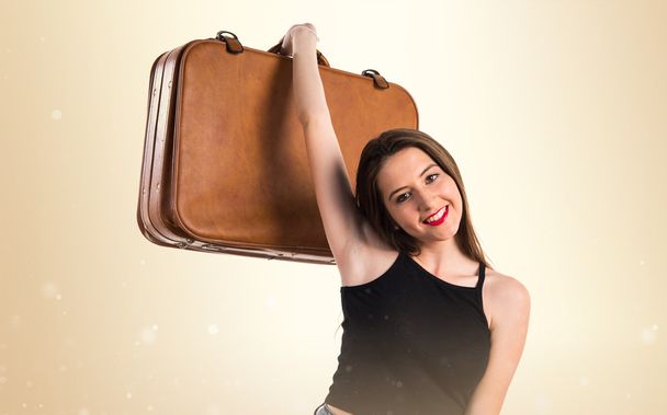 Young girl holding a briefcase - Fotoğraf, Görsel
