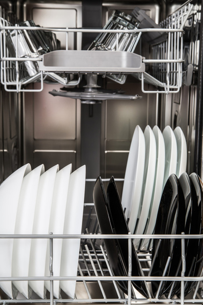 Dishes in a modern dishwasher machine - Фото, зображення