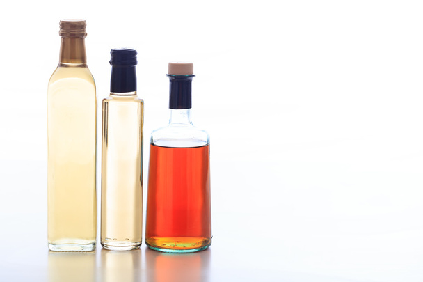 Bottles of vinegar on white background - Photo, Image