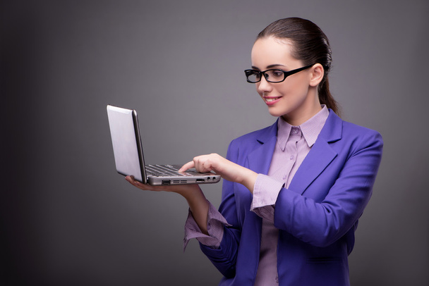 Businesswoman with laptop in business concept - Photo, image