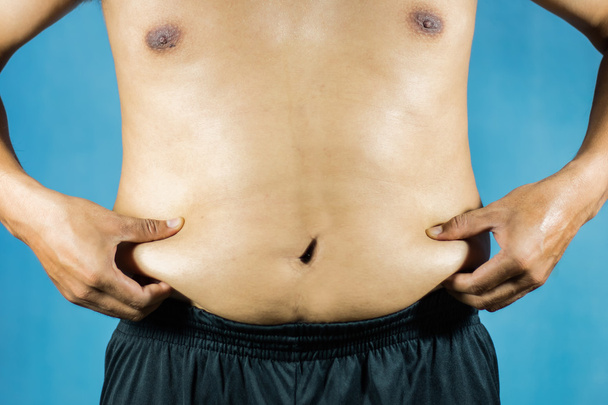 Hombre gordo con un gran vientre, hombre gordo mirando su barriga
 - Foto, imagen