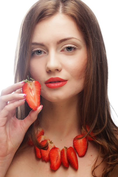 woman with strawberry on the white background - 写真・画像