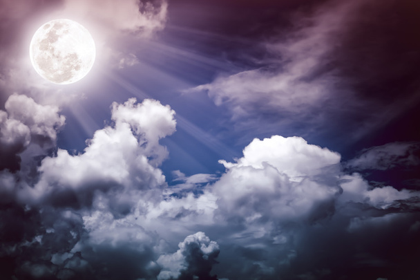 Nighttime sky with clouds, bright full moon.  - Photo, Image