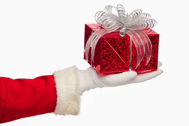 Santa claus giving  christmas present box on a white background, - Фото, изображение