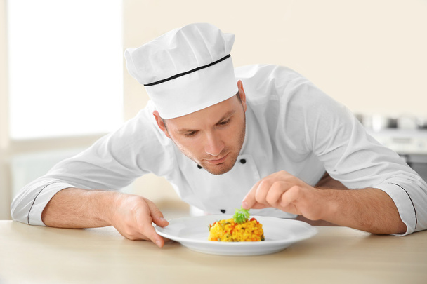 Young chef cook  - Foto, afbeelding