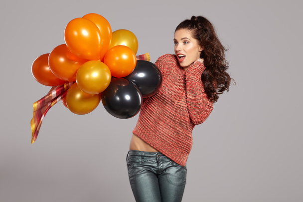 Young pretty woman with colored balloons  - Фото, зображення